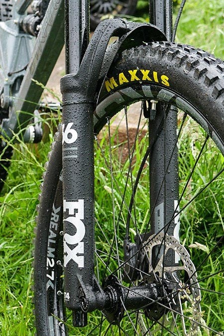 Close up view of the Fox front Suspension forks and Maxxis tyres